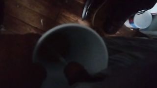 Guy pissing in the coffee mug