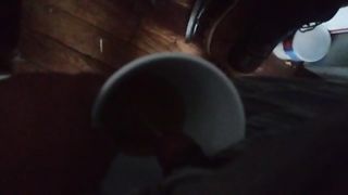 Guy pissing in the coffee mug