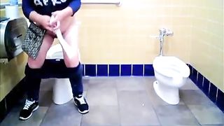 Preggo lady takes a leak in the toilet