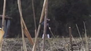 Japanese village chick pooping in the field