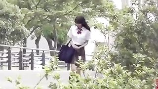 Young sexy Japanese schoolgirl in panty poop