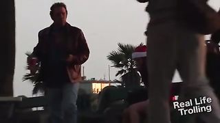 Sexy santa pretends to shit herself in public