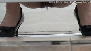 Sexy woman drops her jizz and a big turd in a public toilet