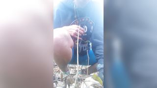 Sporty chick pooping in the forest