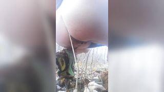 Sporty chick pooping in the forest