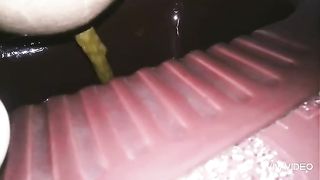 Asian babe pooping in the toilet