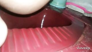 Asian babe pooping in the toilet