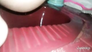 Asian babe pooping in the toilet