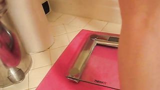 The girl pooped and weighed herself on the scales
