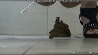 Voyeur woman poops in the floor in a Chinese toilet