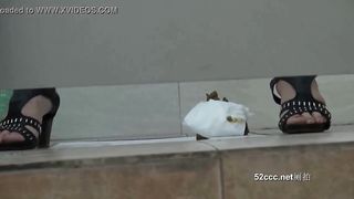 Voyeur woman poops in the floor in a Chinese toilet