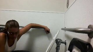 Mature pooping in public bathroom
