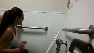 Mature pooping in public bathroom