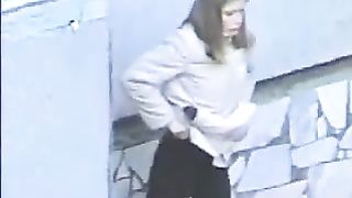 Curvy redhead Japanese chick caught pooping in the corner