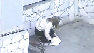 Curvy redhead Japanese chick caught pooping in the corner