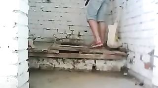 Girl caught pooping in a wooden toilet