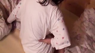 Babe in diaper pooping in the bedroom