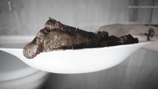 Eating her own tasty fresh waste