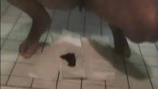 Brunette shitting on the bathroom floor