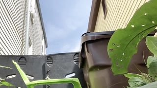 Naked redhead babe pooping in the garden