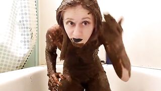 Goth girl smears her entire body with shit