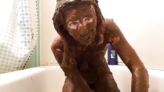 Goth girl smears her entire body with shit