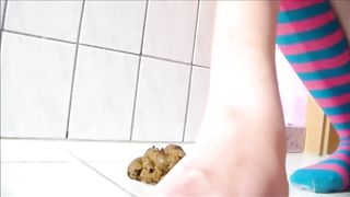 Long legs girl shitting on the bathroom floor