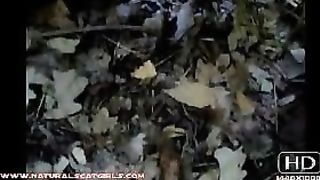 Sexy brunette babe pooping in the jungle