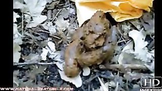 Sexy brunette babe pooping in the jungle