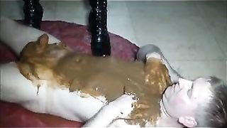 Scat slave gets covered all over in shit
