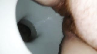 Chubby hairy milf pooping in toilet