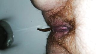 Chubby hairy milf pooping in toilet