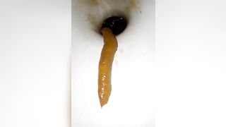 Deep closeup of pooping asshole