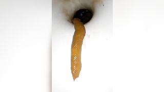 Deep closeup of pooping asshole