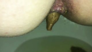 Ugly hairy ass taking out green turd