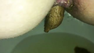 Ugly hairy ass taking out green turd