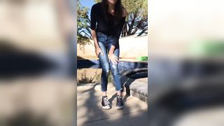 Desperate piss in her jeans outdoor