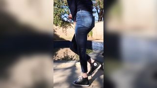 Desperate piss in her jeans outdoor