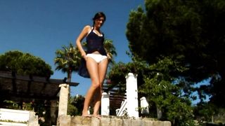 Hot tall brunette babe pissing while standing