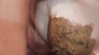 Chubby woman smearing shit on her tits