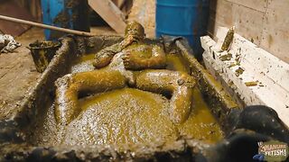 Naughty girl playing in manure basin
