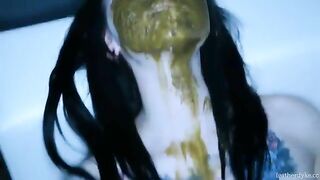 Tattooed babe smearing shit on her lovely face