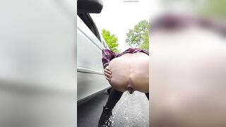 Lady shits beside her car