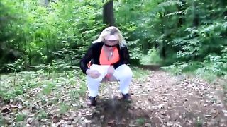 Nasty lady shitting in the forest