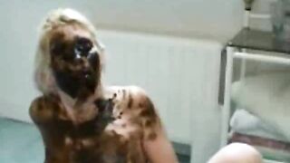 Sexy blonde girl smearing shit