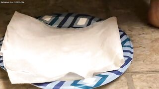 Babe shits on paper napkin on a plate.