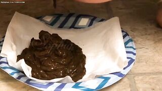 Babe shits on paper napkin on a plate.