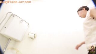 Pretty Japanese lady with hairy pussy caught shitting in the toilet