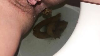 Closeup of hairy slut pooping
