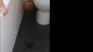 Girl shitting on the bathroom floor